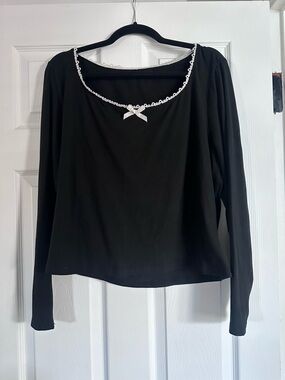 Black Long-Sleeve Women's Top with Decorative Trim and Bow